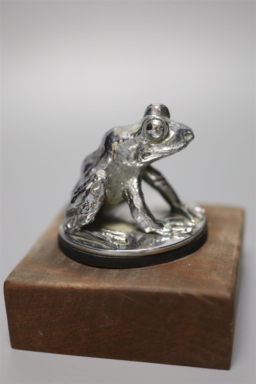 An unusual novelty 20th century chrome car mascot in the form of a urinating terrier, stamped Lejeune, made in England to underside,